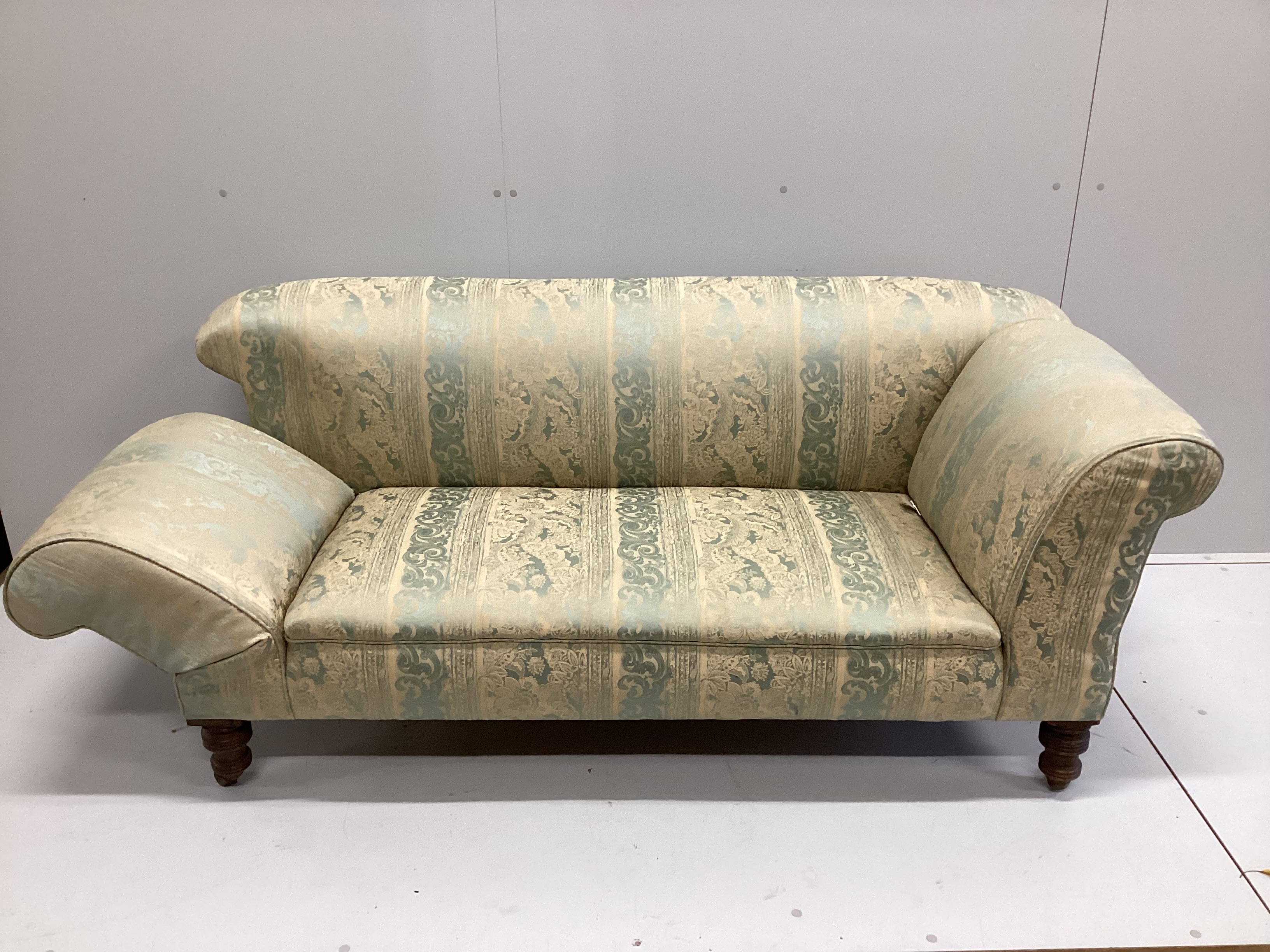 A late Victorian upholstered drop arm Chesterfield settee, length 170cm, depth 80cm, height 70cm